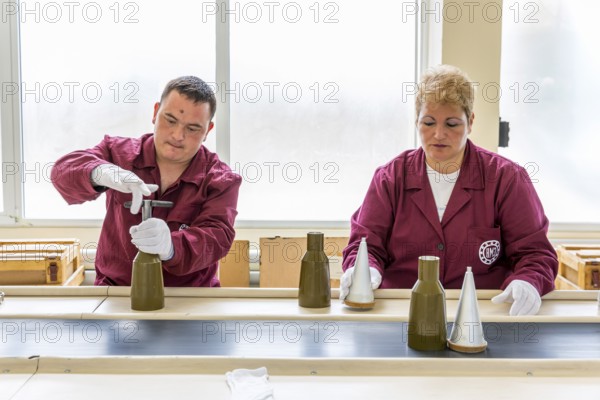 Sopot, Bulgaria - May 17, 2016: Workers are tightening explosive elements of anti-tank