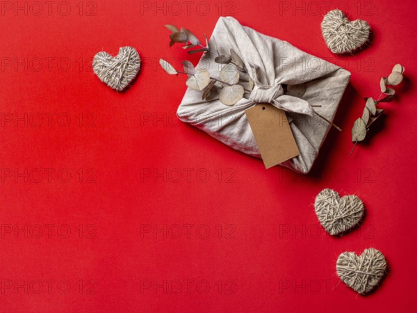Zero waste, Valentine's Day eco-friendly gift wrapping in Furoshiki style with dry eucalypt and