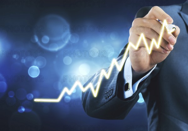 Close view of businessman drawing on screen growing graph