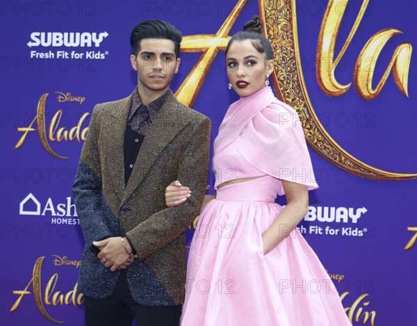 Mena Massoud and Naomi Scott at the Los Angeles premiere of 'Aladdin' held at the El Capitan