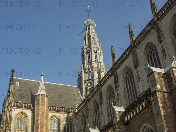 Gothic church architecture and church tower against the clear blue sky, haarlem, netherlands