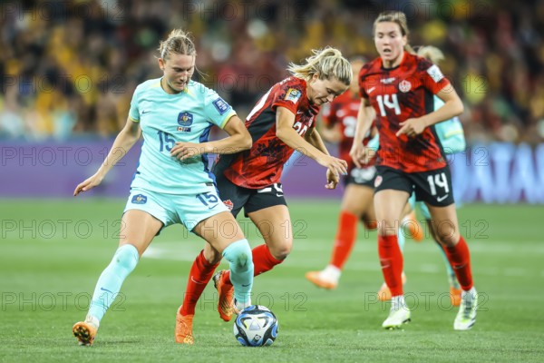 MELBOURNE, AUSTRALIA, JULY 31: Clare HUNT of Australia and Cloe LACASSE of Canada tackle as
