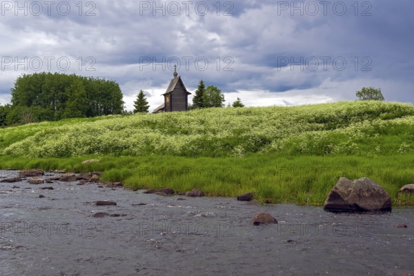 Wooden chapel on the banks of the river Keret. At this point the Keret River flows into the White