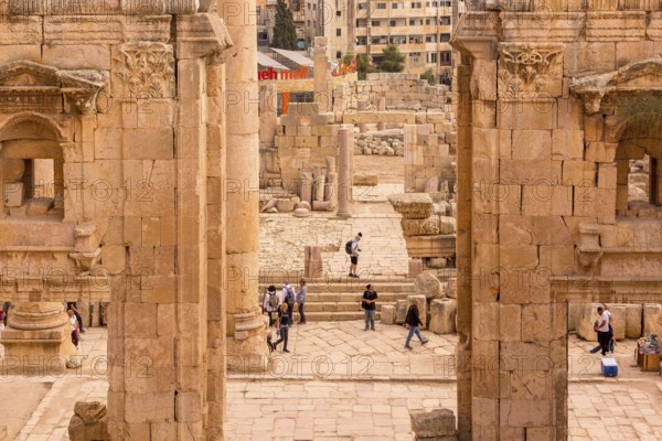 Jerash, Jordan, November 7, 2022: People visiting Gerasa ancient roman city, archs and ancient
