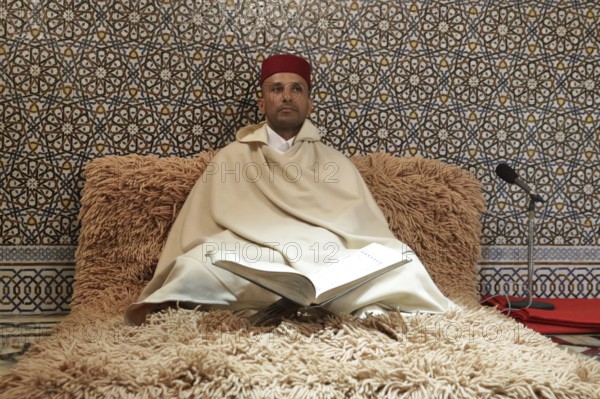 Rabat, Morocco - 29 November 2018: Koran reader sits in The Mausoleum of Mohammed V which is a