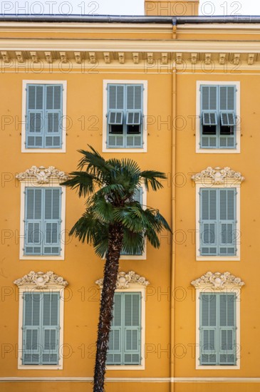 The typical facades of a traditional townhouse in Nice (Nizza), Cote d'Azur, Alpes-Maritimes, PACA,