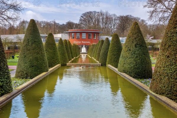 Lisse, Netherlands, April 4, 2016: Spring landscape, touristic park with water fountain and Oranje