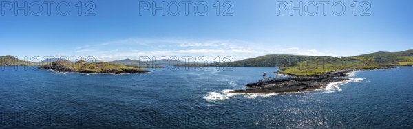 An aerial panorama of the coastal landscape of the Iveragh Peninsula with Beginish and Valentia