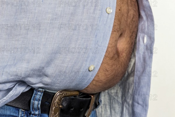 Man with excess weight. Symbolic photo of a beer belly, unsuccessful diets and poor nutrition.