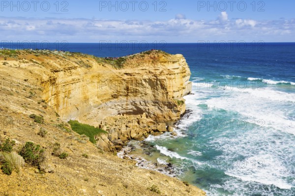 Tourists admire the iconic Twelve Apostles from the Castle Rock lookout, Port Campbell, Victoria,