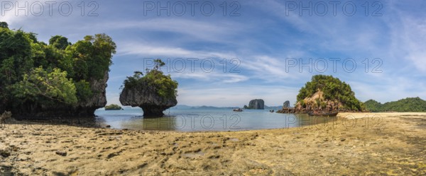 Tropical islands view with ocean blue sea water and white sand beach at Koh Phak Bia, Krabi