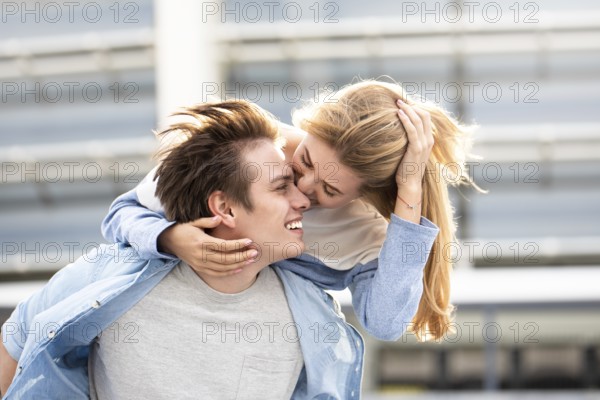 Happy to spending time together. Young beautiful couple outdoor fashion portrait. Attractive boy