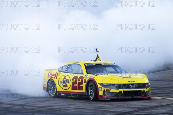 JOEY LOGANO (22) of Middletown, CT celebrates with his team after winning the NASCAR Cup Series
