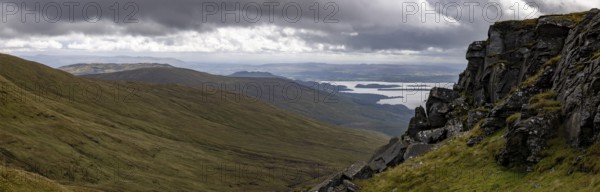 Rocks at the summit and views of Loch Lomond and the Loch Lomond and the Trossachs National Park