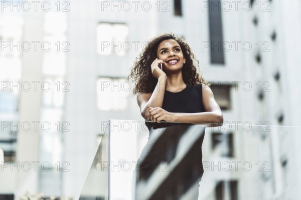 Happy smiling afroamerican woman have a nice conversation at street