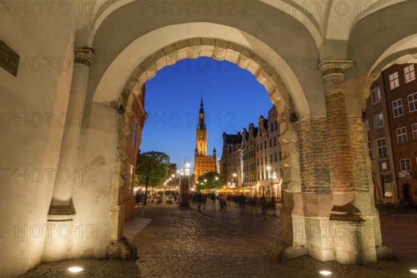 View of the old town of Gdansk with the Main Town Hall through the arch of Green Gate, Poland,