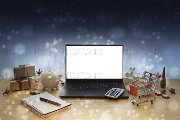 Laptop mockup, online sale offers like Black Friday, table with Christmas decoration, gifts,