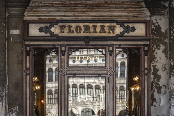 Historic façade of the famous Caffè Florian with reflective windows, Piazza San Marco, symbolic