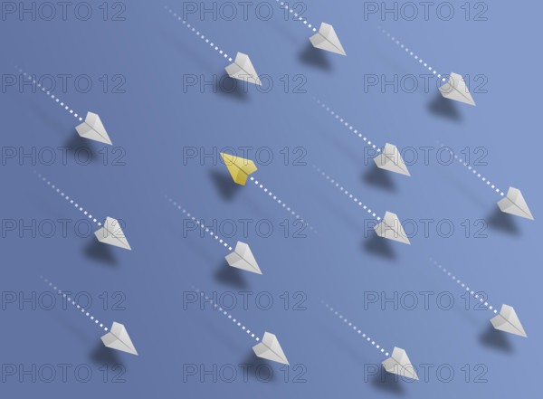 group of paper planes flying in one direction on blue background and one paper glider going in