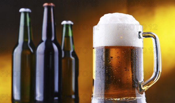 Composition with glass and bottles of beer
