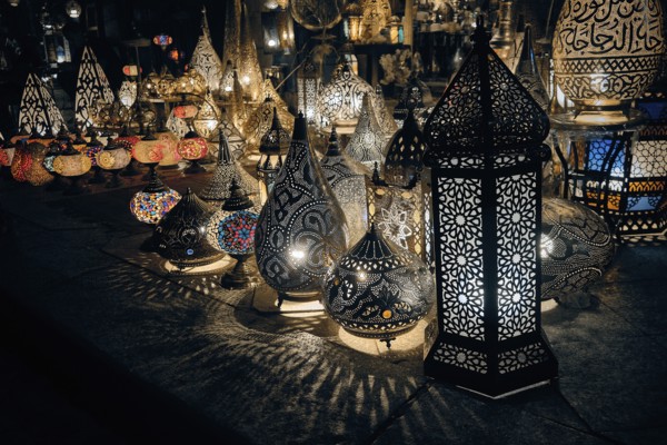 Glowing arabic lamps for sale in front of egyptian souvenir shop. Traditional middle eastern