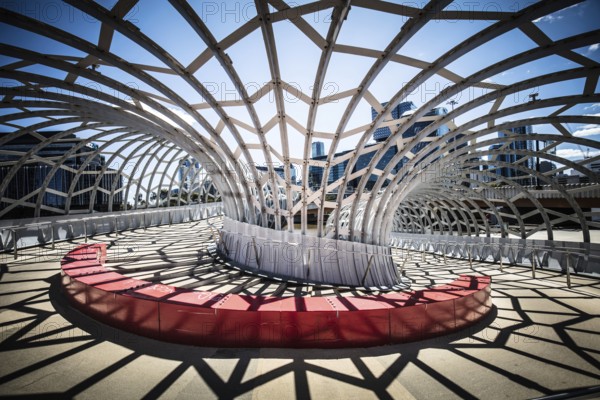 The iconic architecture of Webb Bridge on a warm spring morning in the Docklands area of Melbourne,