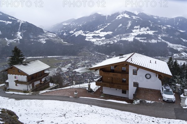Zell am Ziller, Austria, March 11, 2019: Small apartment hotels built in Tyrolean style on the