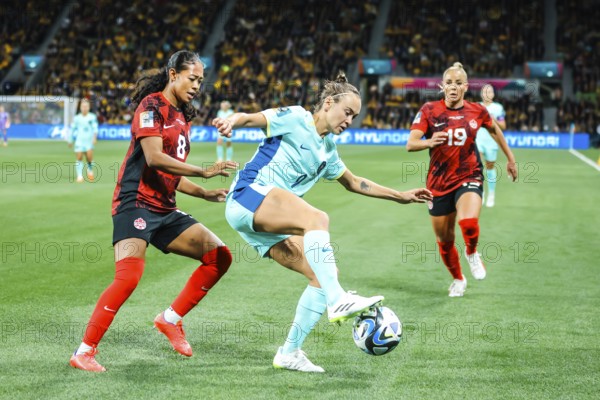 MELBOURNE, AUSTRALIA, JULY 31: Caitlin FOORD of Australia and Jayde RIVIERE of Canada tackle as