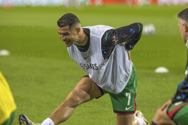 Football match, Cristiano RONALDO CR7 Portugal kneeling during pre-match warm-up with right leg and