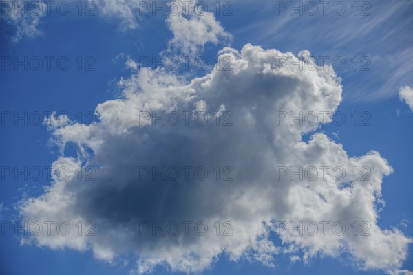 Large, dramatic cloud against a blue sky, creating both light and shadow, Mitterteich, Upper