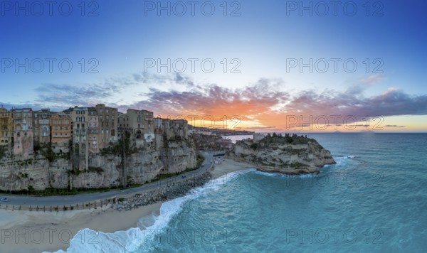 Tropea, Italy, 16 December, 2023: panorama view of Rotonda Beach and the colourful old town of