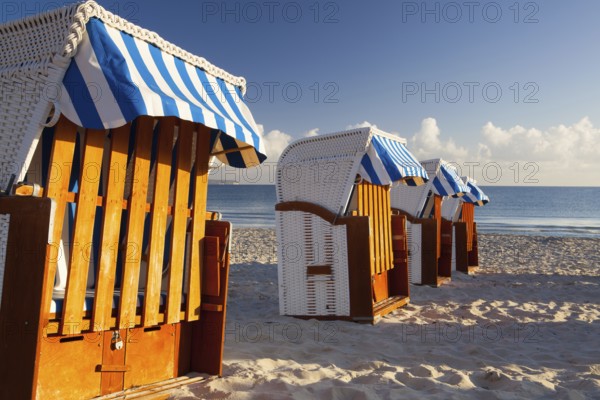 Sandy beach and traditional wooden beach chairs on Rugen island, Northern Germany, on the coast of