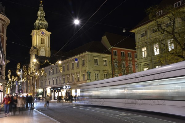 Graz, Austria - November 30, 2019: beautiful Christmas decorations on Herrengasse street, at night,