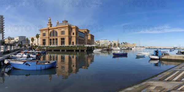 Bari, Italy, 27 November, 2023: view of the historic Teatro Margherita building and fishermen