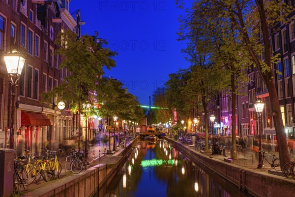 Night view of De Wallen, the famous red-light district with window prostitution in Amsterdam,