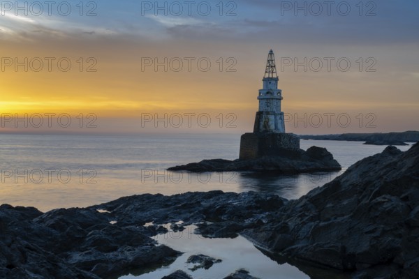 The Athopol Lighthouse on the Black Sea coast of Bulgaria with tidal pools in the foreground at