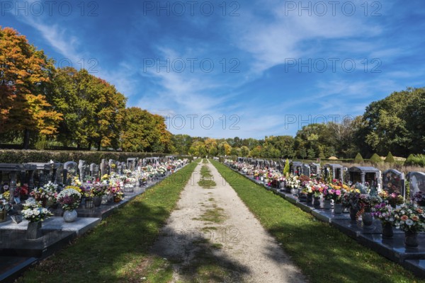 Anderlecht, Brussels, Belgium, 10 11 2018: Decorated grave yards on a cemetery against blue sky,