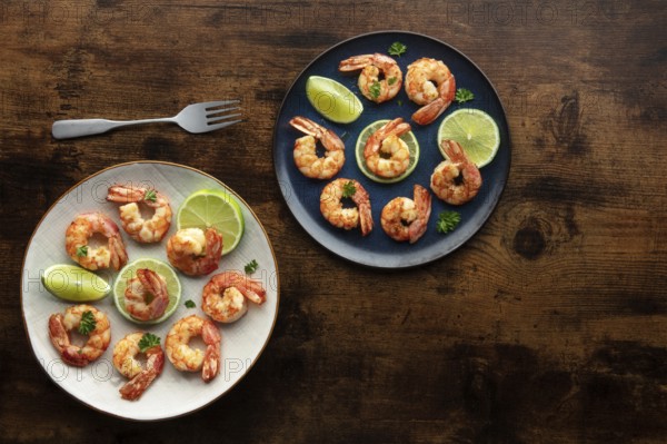 Shrimps, overhead flat lay shot on a rustic wooden background, with copy space. Cooked shrimp with