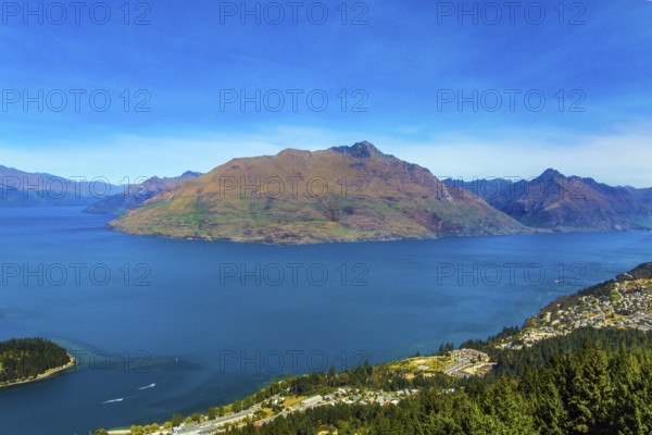 The concept of active, ecological and photo tourism. Bird's eye view. The city Queenstown, shores