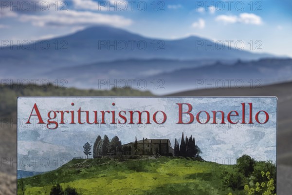 Agriturismo Bonello sign in a picturesque landscape with green meadows and mountains in the
