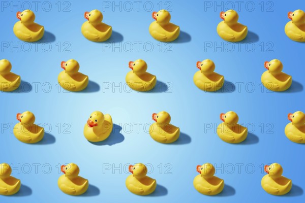 Fashion minimalistic concept of a yellow rubber duck pattern flat lay. Not like everyone else, goes
