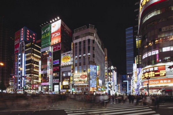Shinjuku, Japan, May 18 2019: Neon signs illuminate Tokyo's busy Shinjuku neighborhood at night