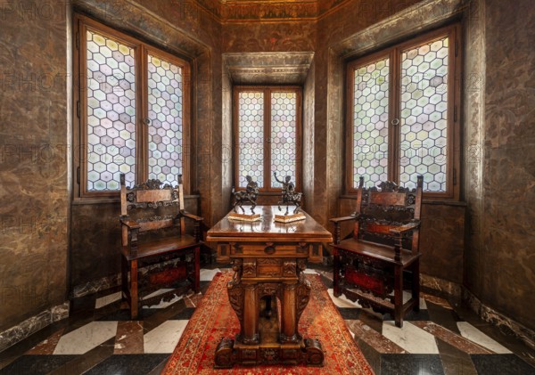 Krakow, Poland, March 23, 2024, Interior of a bowed window with stained glass, luxury chairs and a
