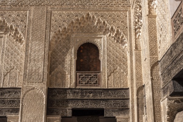 Fes, Morocco, April 05, 2023, Traditional oriental facade at the courtyard of madrasa Bou Inaniya