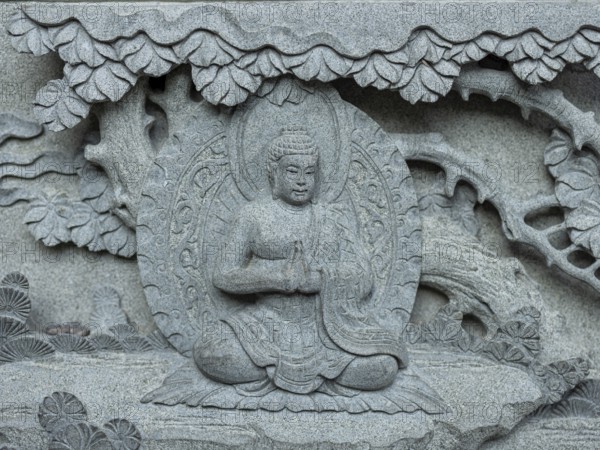 Wall relief depicting Buddha, Kek Lok Si Temple, George Town, Penang, Malaysia, Southeast Asia,