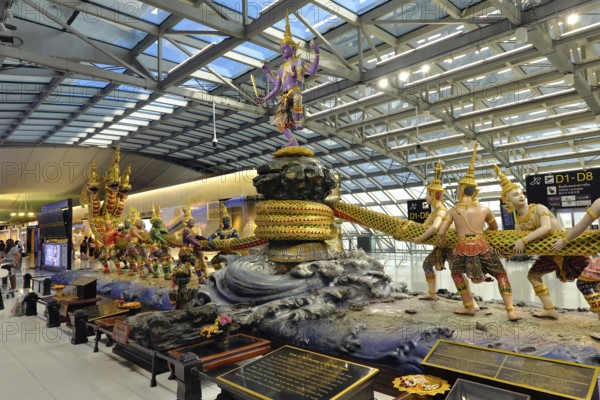 Group of figures from Thai mythology Scene of the Churning of the Milk Ocean in the departure area