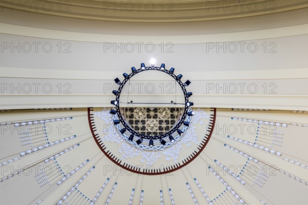 View to the ceiling of a building with modern chandelier and geometric patterns, Prague, Railway