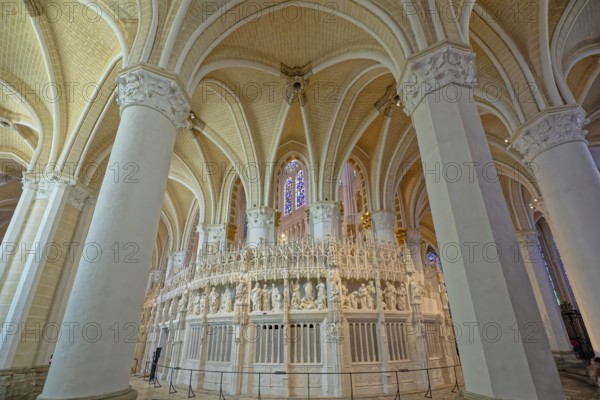 Cathedral interior with spacious gothic style, vaulted ceilings, and ornate stone carvings,
