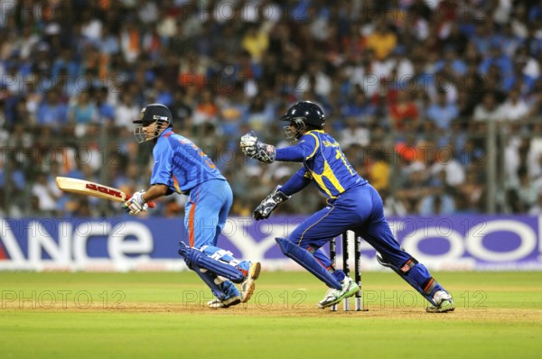 Batsman Gautam Gambhir plays shot Sri Lankan wicketkeeper Sangakkara tries ball 2011 ICC World Cup