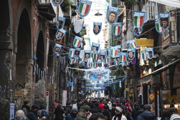 NAPLES, ITALY - JANUARY 14, 2024: A street with the pennants of the football team FC Napoli, the